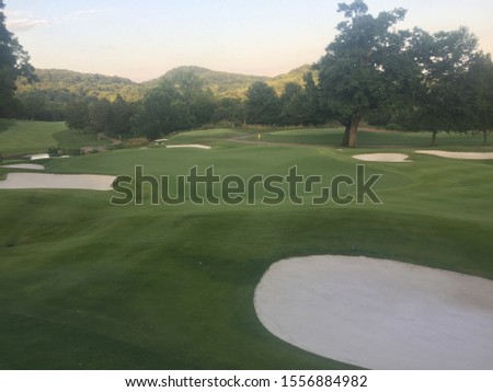 It's a picture of the 18th green at a golf course at a country club.