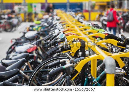 many bicycles at a bicycle stand