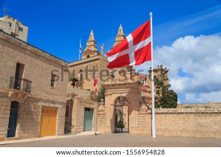 Flag and coat of arms of the Sovereign Military Order of Malta near Pope John Paul II Square