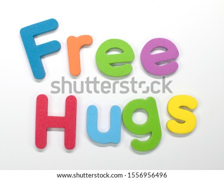 "Free Hugs" written with color sponge