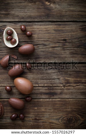 chocolate Easter eggs on dark wooden background