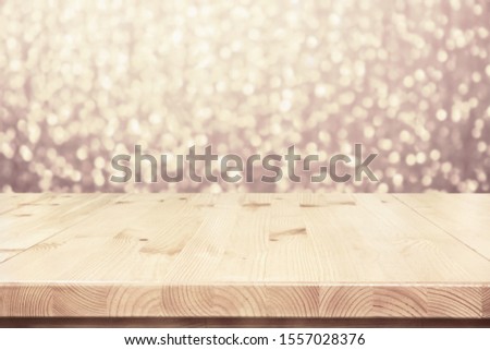 Empty light wooden table top, counter on blurred bokeh lights party background