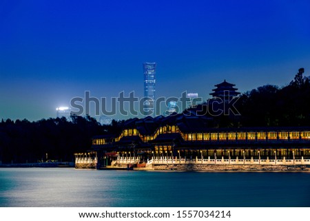 Night view of zhongzhongzun building and ancient buildings in Beihai Park, Beijing
