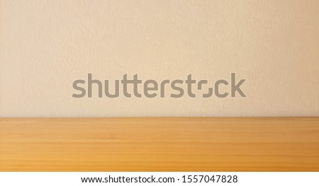 The Image of Empty Wooden Table on Concrete Cement Wall for Background 