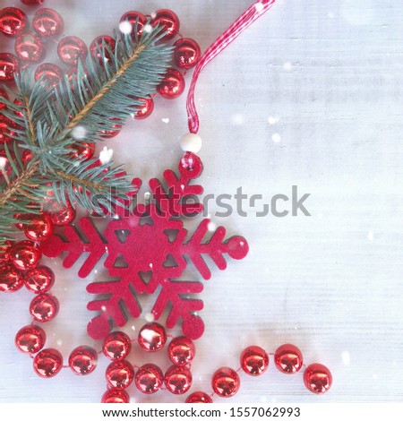Christmas decorations on a white wooden background. Fabric Christmas ornament hanging on wooden background