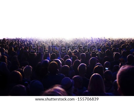 Audience is watching a luminous surface. Royalty-Free Stock Photo #155706839