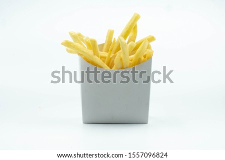 Small  Size of French Fries Package Isolate on White Background Royalty-Free Stock Photo #1557096824