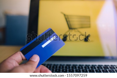 Comfort e-commerce shopping. Royalty high quality free stock photo image of shopping online and payment by credit card. Using laptop and mobile phone to online shopping and pay by visa credit card