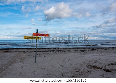 Funny Recreation Signs on a Baltic Sea Beach in November on a Cloudy Day