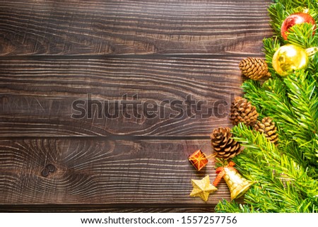 Christmas fir tree, festive. Composition decorations, xmas gift boxes on dark wooden board background. Celebration for holiday concept Christmas, New Year, winter. Flat lay, top view with copy space.