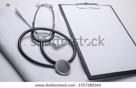 Stethoscope on white background. Heart care concept, cardiology. Matte effect.