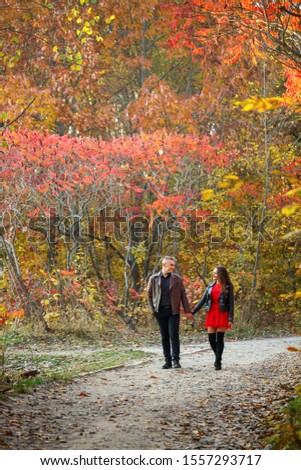 Beautiful couple in the autumn forest