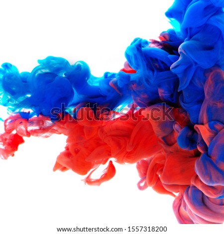 Colorful cloud of blue and red ink on white background. Abstract creative background.