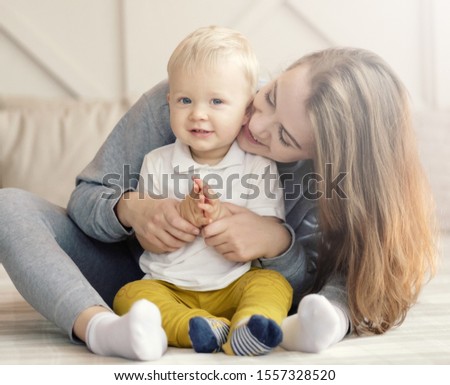 mother and child on bed, mum kiss her son