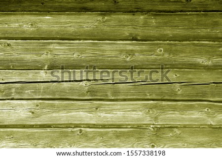 Old grungy wooden planks background in yellow color. Abstract background and texture for design.   