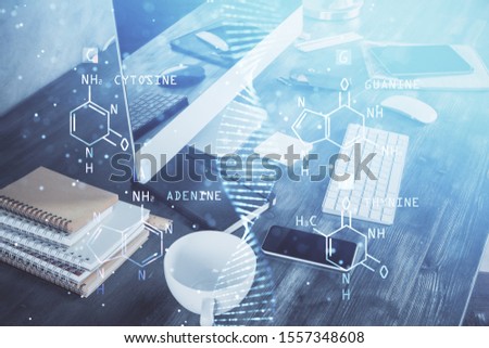Desktop computer background and DNA drawing. Double exposure. Science concept.