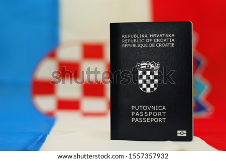Croatian passport on croatian flag