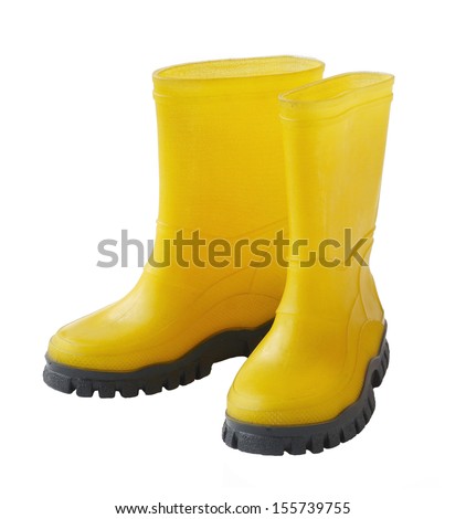 A pair of yellow gumboots isolated on white background Royalty-Free Stock Photo #155739755