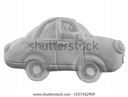 Colorless  car handmade with play dough or clay. Isolated on white background.– Image