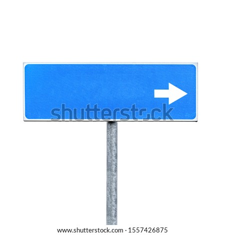 New blank blue road sign with an empty place for destination name and direction arrow isolated on white background Royalty-Free Stock Photo #1557426875