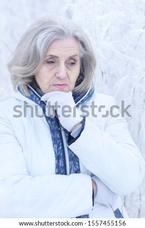 Close up portrait of sad beautiful senior woman