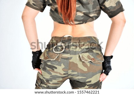 girl in uniform with handcuffs on the belt