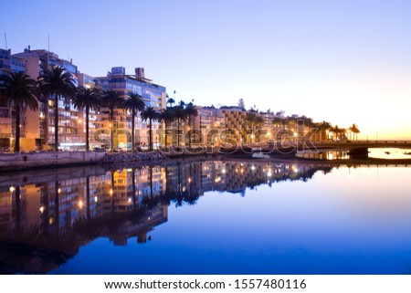 Apartment buildings and Marga Marga River flowing into the ocean at sunset, Vina del Mar, Valparaiso Region, Chile, South America
