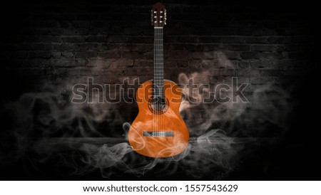 Guitar in a dark room with brick walls, wooden floor. Smoke, abstract light. Dark empty scene with a musical instrument.