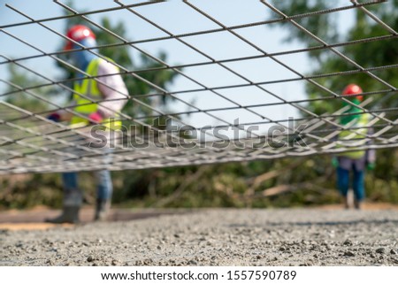 Steel wire mesh for concrete road work Royalty-Free Stock Photo #1557590789