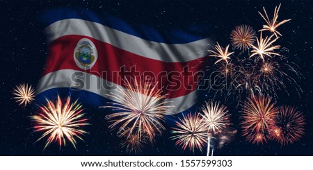 Holiday sky with fireworks and flag of Costa Rica, independence day of country