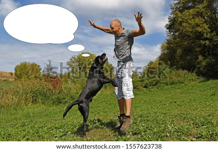 Funny picture with bubble idea man is jumping with dog in the park at sunny day.