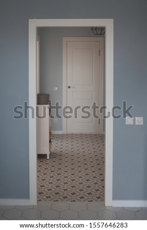Beautiful modern interior design in the kitchen in the Scandinavian style. White grey kitchen room organization