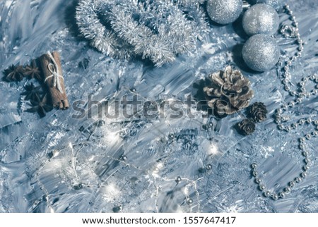 Christmas decorations on a gray background with luminous lights.Flat lay card