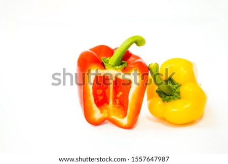 Bell pepper is cultivar group of the species Capsicum annuum, cultivars of the plant produce fruits in different color in picture show beautiful slice red and yellow bell pepper on white background
