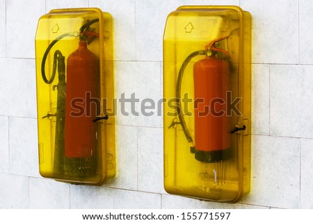 red fire extinguisher on the wall