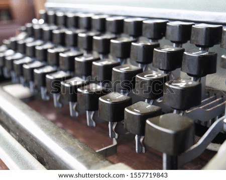 Closeup button of an old typewriter, selective focus