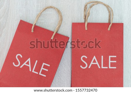 SALE sign on bag,Red shopping bag cut out on white 