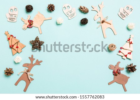 Top view of Christmas decorations on blue background. New Year holiday concept with copy space.