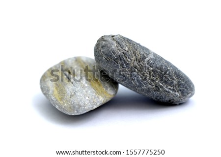 stone from the beach pictured in studio on white background, 