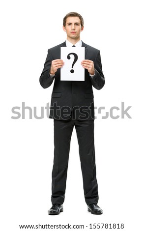 Full-length portrait of business man handing question mark, isolated on white. Concept of problem and solution
