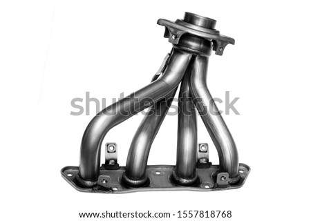 Metallic new car exhaust manifold on a white background. The front of the exhaust system of an exhaust gas of an internal combustion engine. Royalty-Free Stock Photo #1557818768