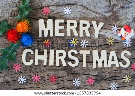 Wording Merry Christmas on old wooden background,Christmas and   Happy New Year concept. Top view.