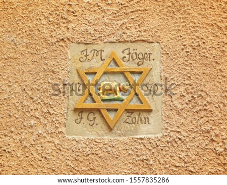 Symbol of jewish star of david on the front on old building