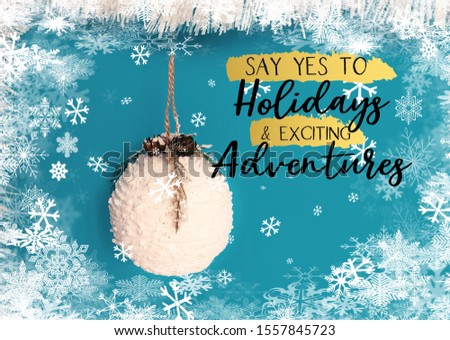 white snowflakes on blue background with Christmas and New Year wishes text quotes greeting card banner 