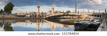 Stunning Pont Alexandre III bridge (1896) spanning the river Seine. Decorated with ornate Art Nouveau lamps and sculptures it is the most extravagant bridge in Paris.