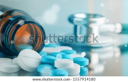 Bottle with pills euthanasia viagra alternative analgesics antibiotics care Royalty-Free Stock Photo #1557914180