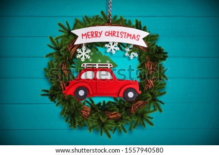 Christmas tree wreath with red car background