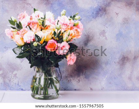 Rose fresh flowers bouquet on gray table with copy space, toned