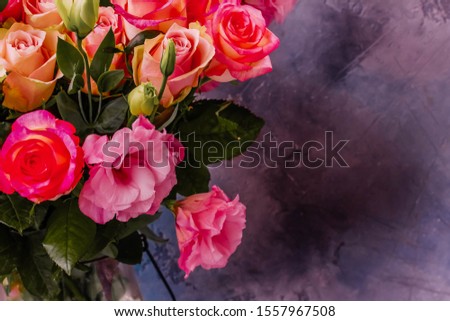 Rose fresh flowers bouquet on gray background with copy space, toned