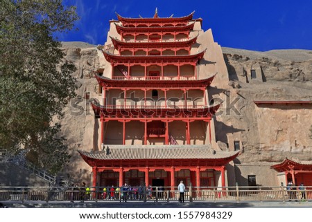 9 story high wooden porch of cave 96-Mogao Caves S.section comprising 492 caves and cell temples-some open for tourist visit housing Buddhist art from centuries 4th to 14th. Dunhuang-Gansu prov.-China